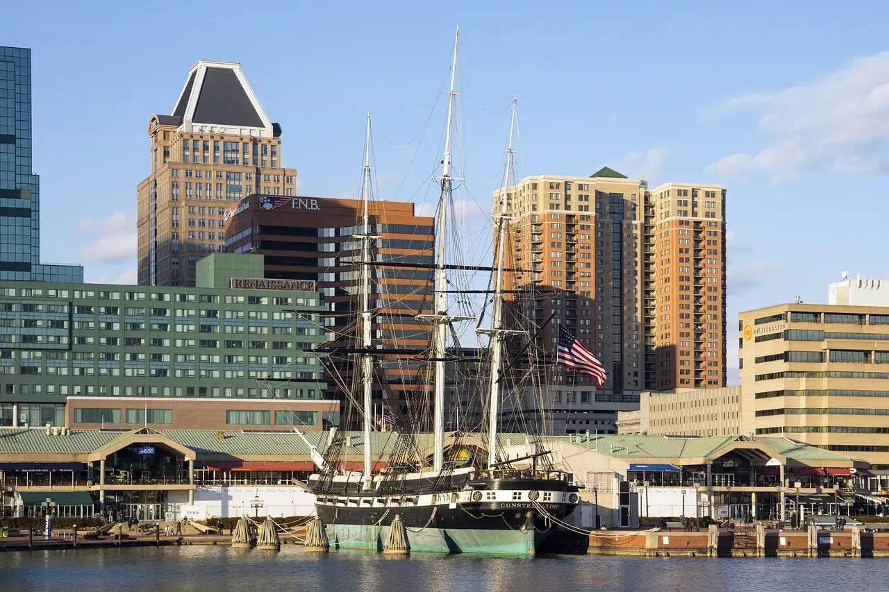 The tall ship USS Constellation moored in Baltimore's Inner Harbor, with office towers behind