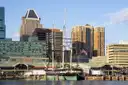 The tall ship USS Constellation moored in Baltimore's Inner Harbor, with office towers behind