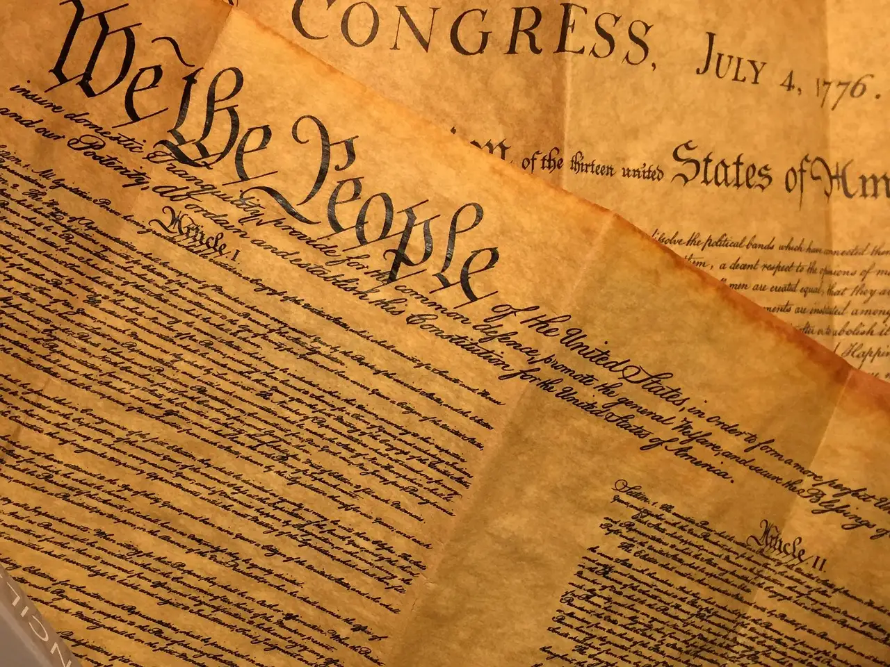 Facsimiles of the Constitution and the Declaration of Independence on aged parchment