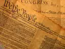 Facsimiles of the Constitution and the Declaration of Independence on aged parchment