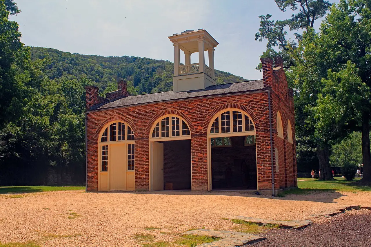 The brick fire engine house at Harpers Ferry, West Virginia, among trees.