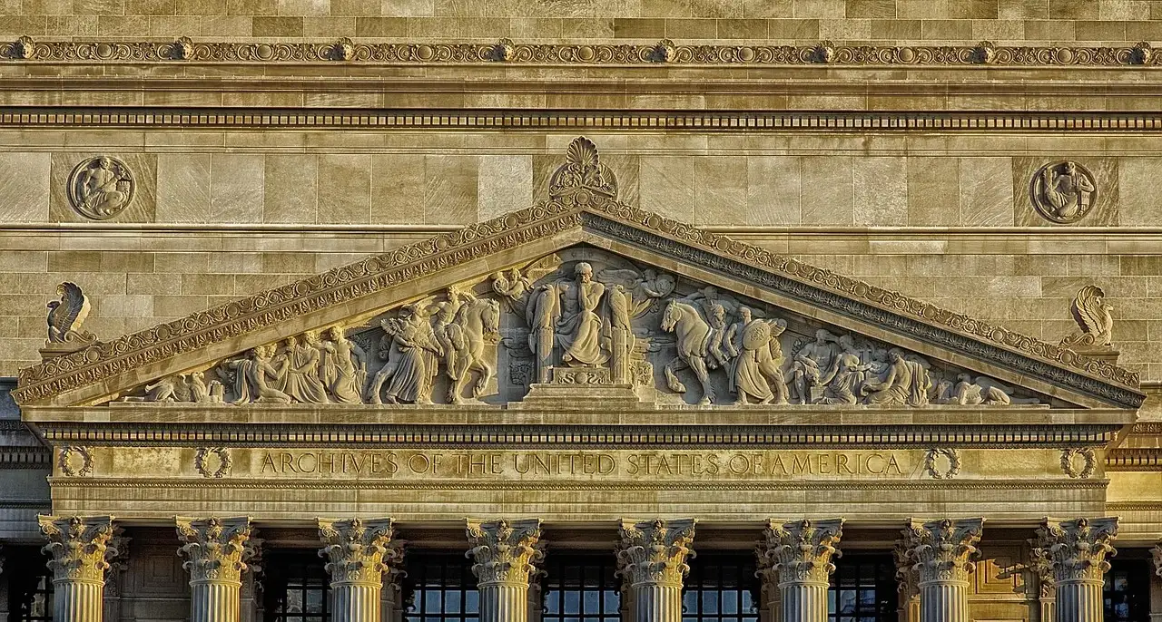 The carved stone pediment and columns of the National Archives Building
