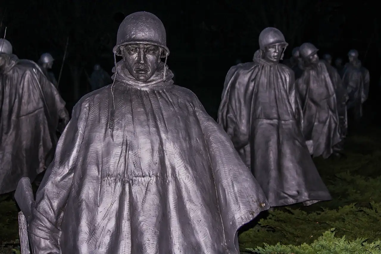 The steel soldier statues of the Korean War Veterans Memorial at night