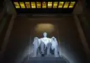 The seated statue of Abraham Lincoln lit inside the Lincoln Memorial