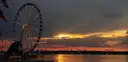 Sunset over the Potomac River at National Harbor, with a Ferris wheel on the shore