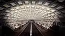 The coffered concrete vault of a Washington, DC Metro station above the tracks and platforms