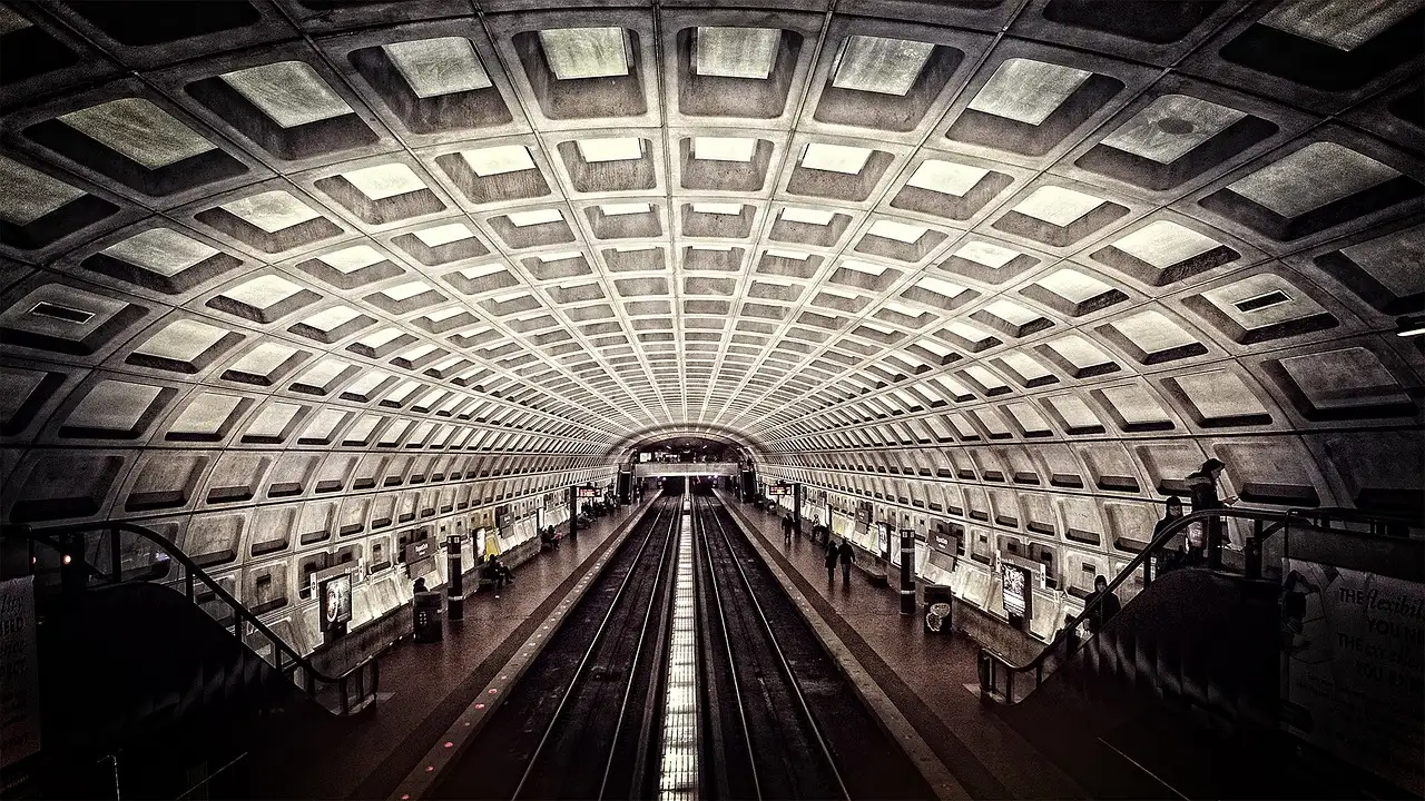 The coffered concrete vault of a Washington, DC Metro station above the tracks and platforms