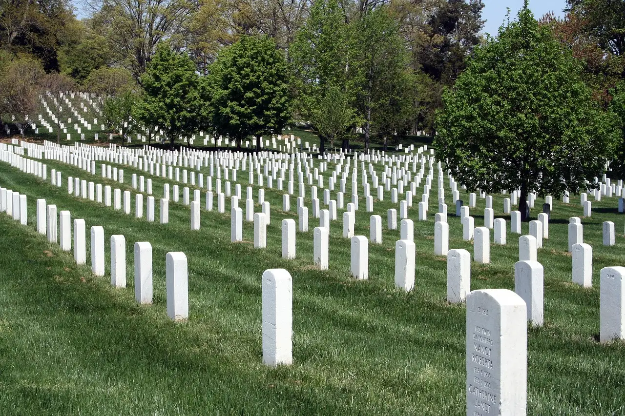 Rows of white headstones on the lawns of Arlington National Cemetery.
