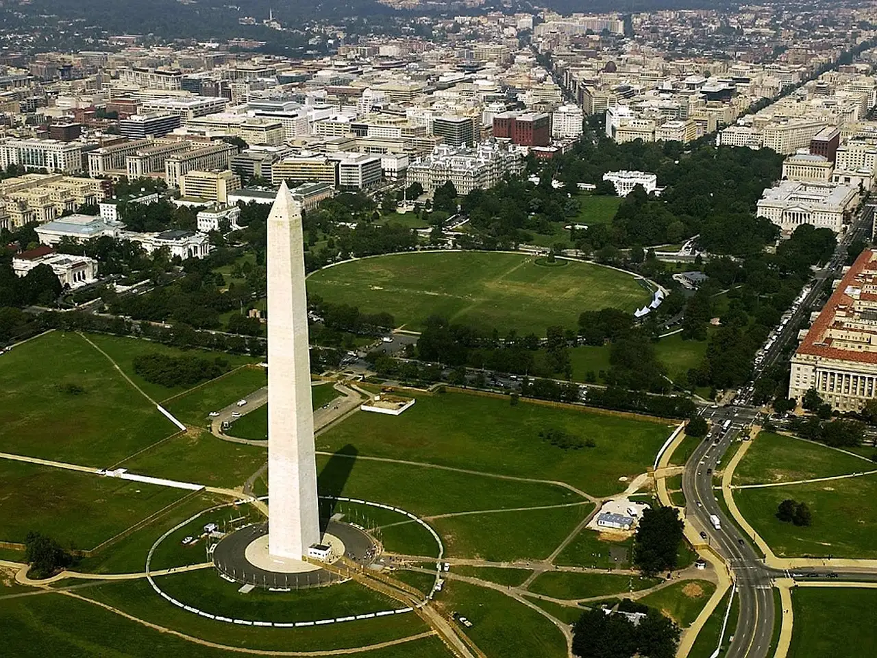 The Washington Monument and the green lawns of the National Mall, seen from above