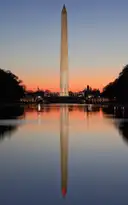 The Washington Monument at dawn, reflected in the Lincoln Memorial Reflecting Pool on the National Mall