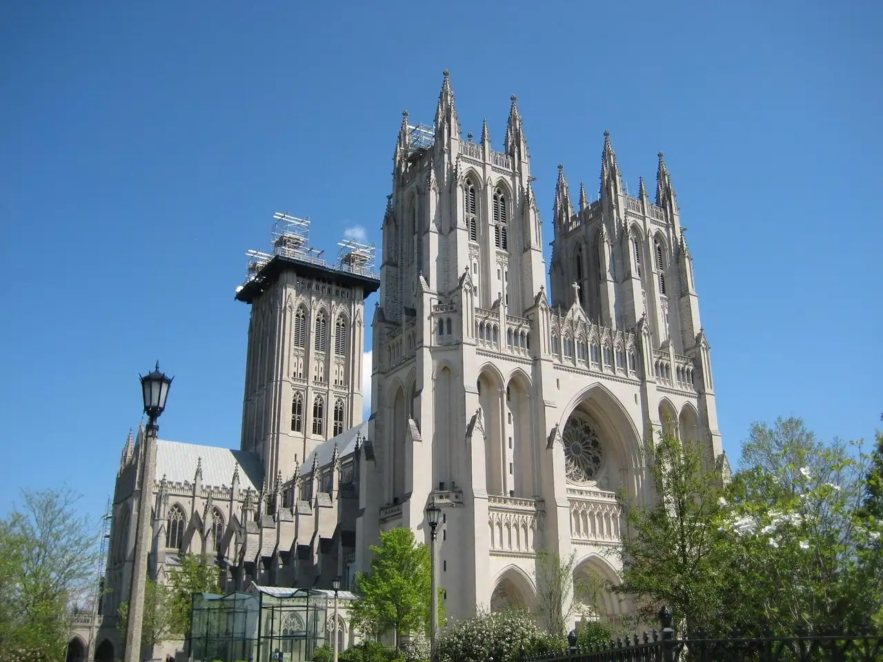 The Gothic towers of Washington National Cathedral under a blue sky